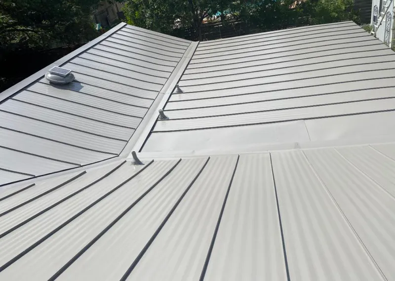 Solar attic fan installed on a metal roof for Roof Ventilation in Steele Creek